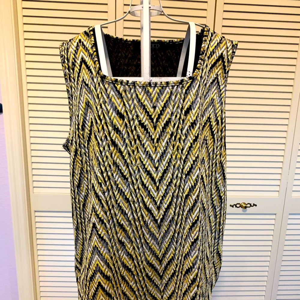 This beautiful sleeveless top in bright yellow, white and black colors.